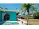 Tropical backyard with patio, palm tree, and pool view at 4010 18Th W Ave, Bradenton, FL 34205