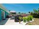 Landscaped backyard with patio, grill, and lush greenery at 4010 18Th W Ave, Bradenton, FL 34205
