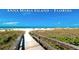 Wooden boardwalk leads to Anna Maria Island beach at 4010 18Th W Ave, Bradenton, FL 34205