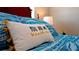 Cozy bedroom with blue bedding and decorative pillows at 4010 18Th W Ave, Bradenton, FL 34205
