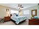 Bedroom with a queen bed and wicker furniture at 4010 18Th W Ave, Bradenton, FL 34205