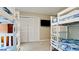 Bedroom with two sets of bunk beds and bi-fold closet doors at 4010 18Th W Ave, Bradenton, FL 34205