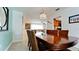 Bright dining area with wood table and chairs, view of kitchen at 4010 18Th W Ave, Bradenton, FL 34205