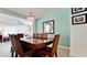 Dining room with a wood table, wicker chairs, and a light fixture at 4010 18Th W Ave, Bradenton, FL 34205