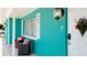 Charming teal house with a welcoming front porch at 4010 18Th W Ave, Bradenton, FL 34205