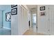 Hallway with bi-fold doors and views into bedrooms and bathroom at 4010 18Th W Ave, Bradenton, FL 34205