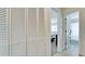Hallway with bi-fold doors and views into bedrooms and bathroom at 4010 18Th W Ave, Bradenton, FL 34205