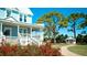 Two-story light blue house with white porch and landscaping at 4010 18Th W Ave, Bradenton, FL 34205
