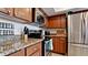 Modern kitchen with stainless steel appliances and granite countertops at 4010 18Th W Ave, Bradenton, FL 34205