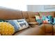 Relaxing living room with brown leather sectional and pillows at 4010 18Th W Ave, Bradenton, FL 34205