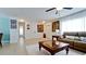 Living room with tiled floors, comfy seating and a coffee table at 4010 18Th W Ave, Bradenton, FL 34205