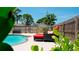 Relaxing pool area with lounge chairs and a wooden fence at 4010 18Th W Ave, Bradenton, FL 34205