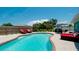 Relaxing kidney-shaped pool with patio furniture and a wooden fence at 4010 18Th W Ave, Bradenton, FL 34205