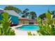 Refreshing kidney-shaped pool surrounded by lush landscaping at 4010 18Th W Ave, Bradenton, FL 34205