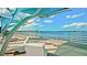 Relaxing waterfront view with shaded seating and a bridge in the distance at 4010 18Th W Ave, Bradenton, FL 34205