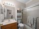 Clean bathroom, shower/tub combo, and wood vanity at 4153 Lenox Blvd, Venice, FL 34293