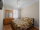 Comfortable bedroom with ceiling fan and leafy bedding at 4153 Lenox Blvd, Venice, FL 34293