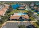 Community pool with surrounding lounge chairs and parking at 4153 Lenox Blvd, Venice, FL 34293