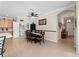 Open dining room with table and chairs, near the kitchen and entryway at 4153 Lenox Blvd, Venice, FL 34293