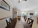 Formal dining room features a dark wood table with seating for six at 4153 Lenox Blvd, Venice, FL 34293