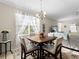Charming dining area with table and chairs, near the kitchen at 4153 Lenox Blvd, Venice, FL 34293