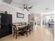 Spacious dining area with a large table and access to kitchen at 4153 Lenox Blvd, Venice, FL 34293