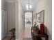 Bright and airy entryway with console table and mirror at 4153 Lenox Blvd, Venice, FL 34293