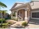 Front porch with arched entryway and white railings at 4153 Lenox Blvd, Venice, FL 34293
