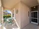 Front porch with a table, chairs and entryway at 4153 Lenox Blvd, Venice, FL 34293