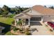 Front exterior of house with landscaping and driveway at 4153 Lenox Blvd, Venice, FL 34293