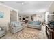 Spacious living room features a large seating area and an open floor plan at 4153 Lenox Blvd, Venice, FL 34293