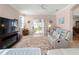 Bright living room with comfy seating, a fireplace, and access to the backyard at 4153 Lenox Blvd, Venice, FL 34293