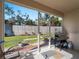 Relaxing screened patio with grill, overlooking backyard at 4153 Lenox Blvd, Venice, FL 34293