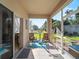 Screened porch with view of pond and backyard at 4153 Lenox Blvd, Venice, FL 34293