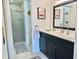 Bathroom features a walk-in shower, double vanity, and updated fixtures at 4515 45Th W Ave # 201A, Bradenton, FL 34210