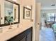 Bathroom with vanity, mirror, and view into bedroom at 4515 45Th W Ave # 201A, Bradenton, FL 34210
