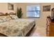 Main bedroom with a king-size bed and coastal decor at 4515 45Th W Ave # 201A, Bradenton, FL 34210