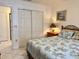 Bedroom with king-size bed, dresser, and sliding closet doors at 4515 45Th W Ave # 201A, Bradenton, FL 34210