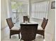 Bright dining area featuring a glass-top table and wicker chairs at 4515 45Th W Ave # 201A, Bradenton, FL 34210