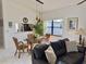 Bright dining area with a glass-top table and wicker chairs at 4515 45Th W Ave # 201A, Bradenton, FL 34210
