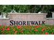 Shorewalk community entrance with red flowers at 4515 45Th W Ave # 201A, Bradenton, FL 34210