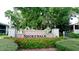 Shorewalk community entrance with red flowers at 4515 45Th W Ave # 201A, Bradenton, FL 34210