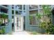 Building exterior with light teal siding and white door at 4515 45Th W Ave # 201A, Bradenton, FL 34210