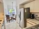 Modern kitchen with stainless steel appliances and adjacent breakfast area at 4515 45Th W Ave # 201A, Bradenton, FL 34210