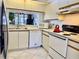 Efficient kitchen featuring updated appliances and ample cabinet space at 4515 45Th W Ave # 201A, Bradenton, FL 34210