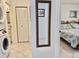 Shared laundry room with washer and dryer, and bedroom access at 4515 45Th W Ave # 201A, Bradenton, FL 34210