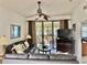 Spacious living room with leather sofas, large TV, and access to a balcony at 4515 45Th W Ave # 201A, Bradenton, FL 34210