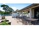 Community patio with metal tables and chairs at 4515 45Th W Ave # 201A, Bradenton, FL 34210