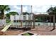 Community playground with slide and climbing structure at 4515 45Th W Ave # 201A, Bradenton, FL 34210