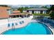 Kidney shaped pool with surrounding patio and hot tub at 4515 45Th W Ave # 201A, Bradenton, FL 34210